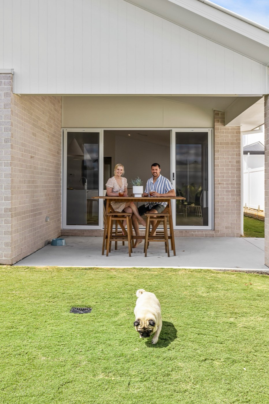 Covered patio with owners and their dog, Brisbane